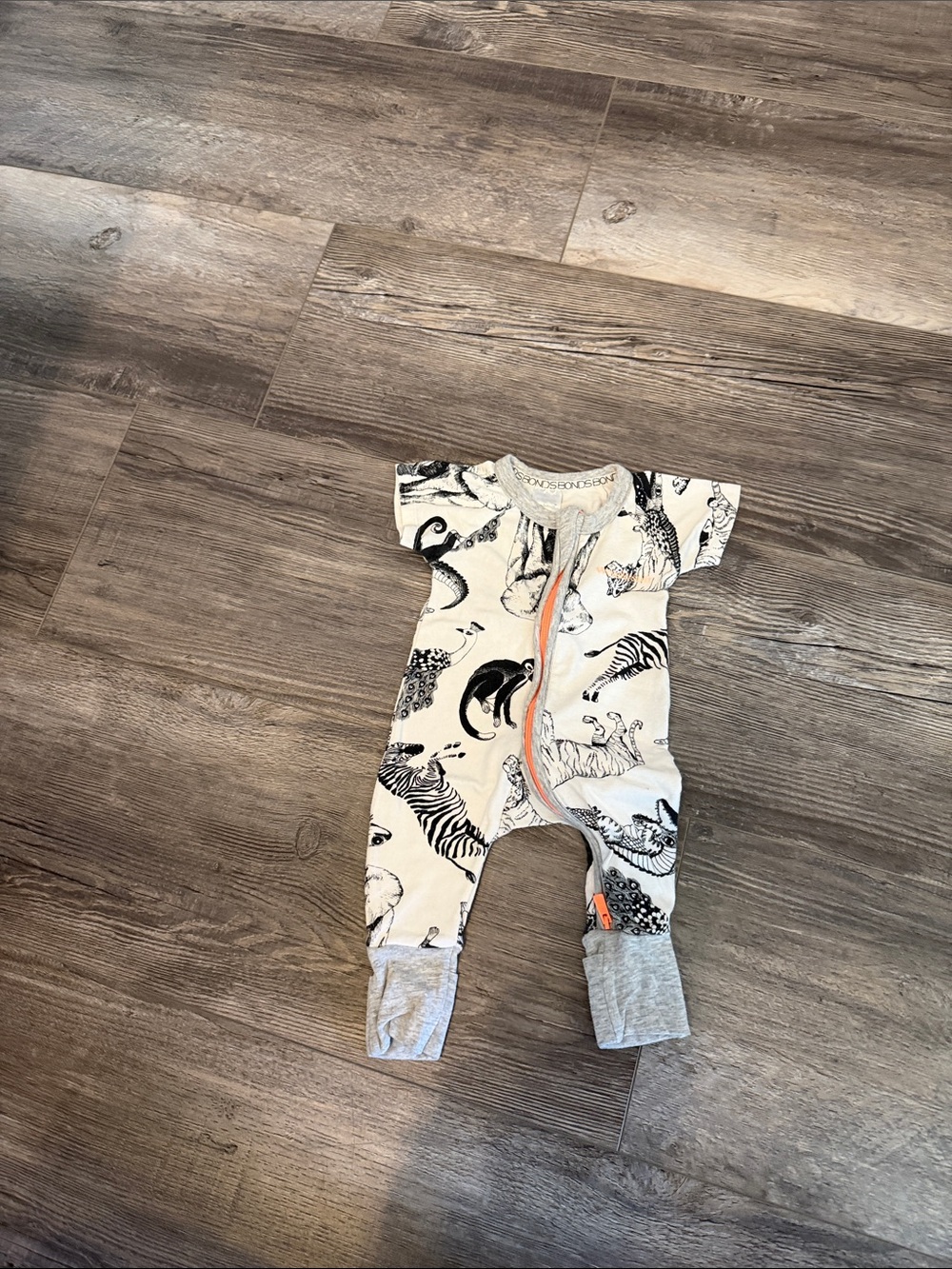 Bonds Baby One-Piece Romper in White with Black Animal Print